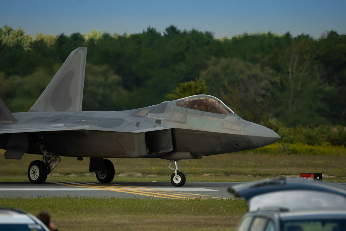 A military fighter jet taxiing on a runway